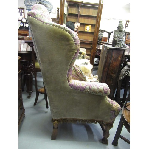 1503 - 19th Century wingback armchair, in Carolean style on shaped supports with crossover stretcher (for r... 