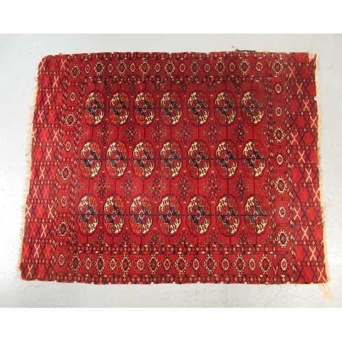 15 - Small Tekke rug with three rows of seven gols on a wine ground (borders reduced)