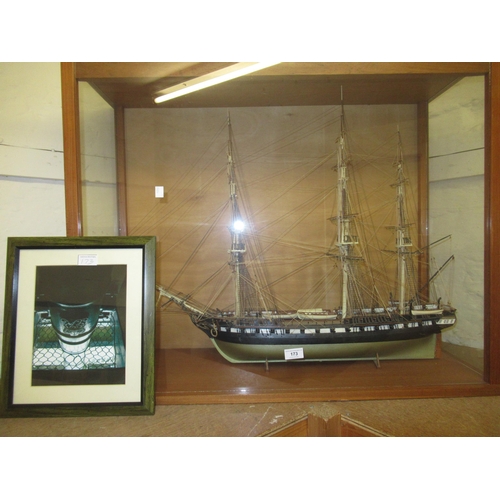 Modern hand built model of the USS Constitution in a glazed display case, 72 x 90cm x 34cm deep, together with a framed photograph of a cannon from the ship