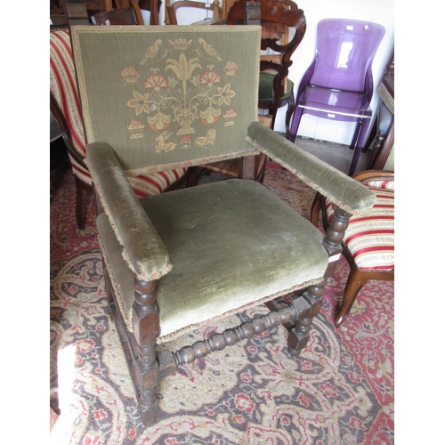 Pair of oak Cromwellian style open arm chairs with green embroidered backs