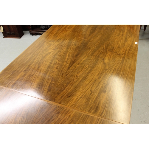 1498 - Gordon Russell Limited, walnut rectangular dining table with integral single leaf on square supports... 