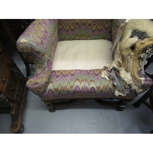 1503 - 19th Century wingback armchair, in Carolean style on shaped supports with crossover stretcher (for r... 