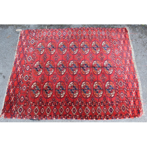 1 - Small Tekke rug with three rows of seven gols on a wine ground (borders reduced)