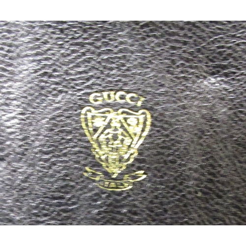 101 - Gucci burgundy leather bag (at fault), 18.5cm wide, with original dust bag