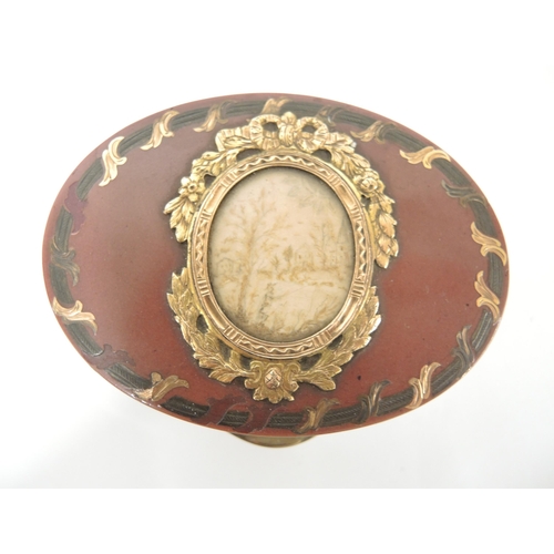 106 - 18th / 19th Century French oval tortoiseshell gold mounted and inlaid box, the cover having an inset... 