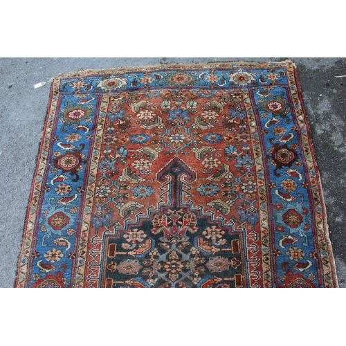 13 - Antique Hamadan rug with a lobed medallion and all-over Herati design on a red ground with borders, ... 