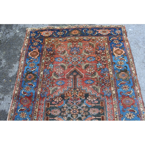 13 - Antique Hamadan rug with a lobed medallion and all-over Herati design on a red ground with borders, ... 