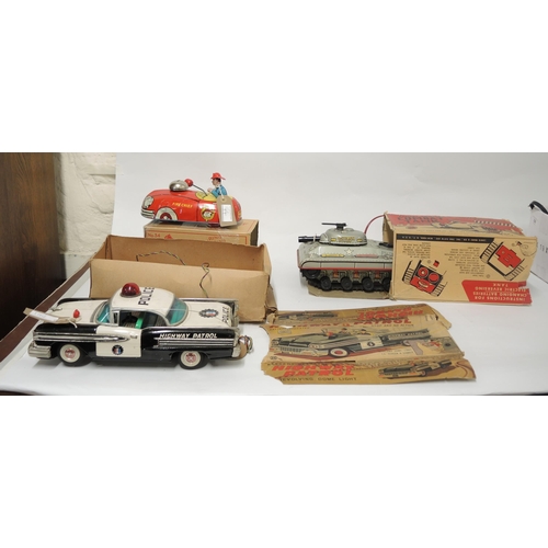 144 - Louis Marx, American boxed battery operated tinplate model combat tank, together with two other boxe... 