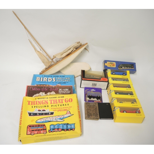 166 - Box containing a quantity of various children's boxed games, toy cars and a pond yacht by Bowman