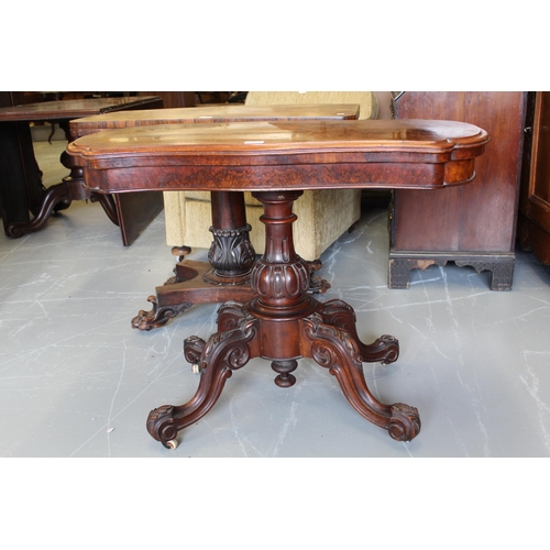 1945 - 19th Century walnut shaped top fold-over card table on single column support, with cabriole carved l... 