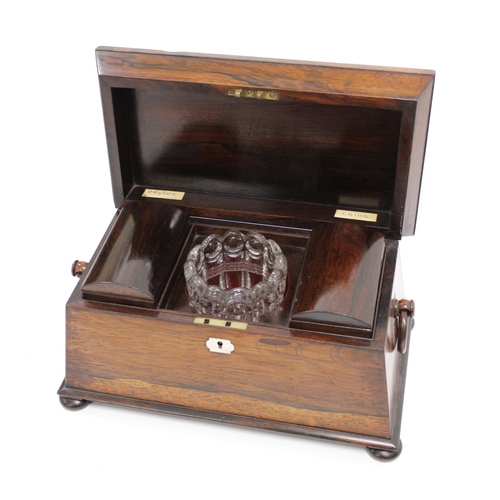 1965 - 19th Century rosewood sarcophagus shaped tea caddy with a hinged cover enclosing a three division in... 