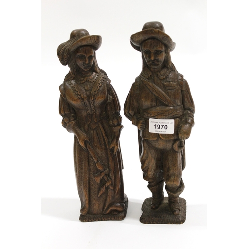 1970 - Pair of 19th century Flemish carved oak figures of a man and a woman, 30cm high