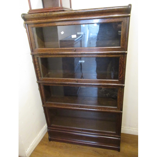 1983 - Oak Globe Wernicke four section bookcase with glazed doors above a single drawer, 144cm high x 87cm ... 