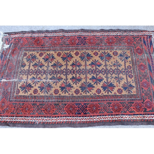 22 - Belouch rug with all-over floral and geometric design, with floral borders on a rust ground, 210 x 1... 