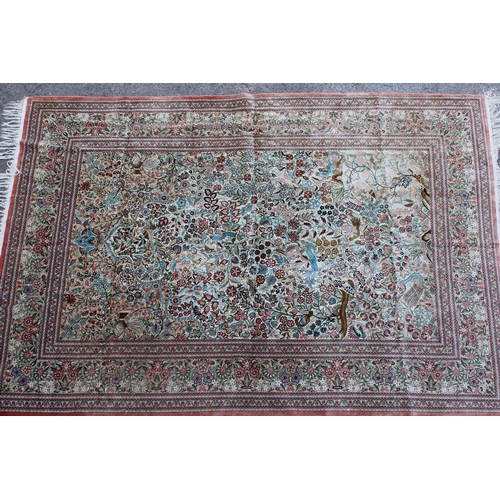 24 - Chinese part silk carpet of Persian design with all-over floral, bird and animal design and floral b... 