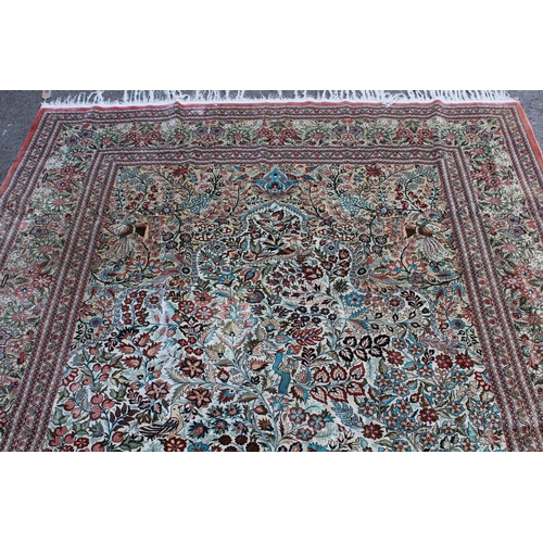 24 - Chinese part silk carpet of Persian design with all-over floral, bird and animal design and floral b... 