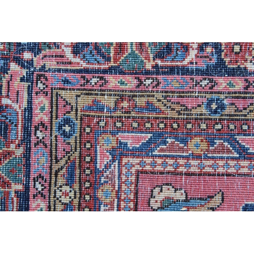 25 - Sarouk rug of all-over floral design with floral borders on a wine ground, 198 x 128cm