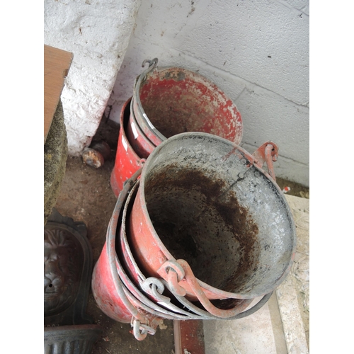 255 - Group of seven various red painted 20th Century anodised fire buckets (at fault)