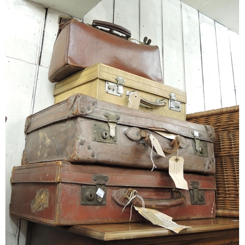 256 - Gladstone leather brass mounted Gladstone bag, pig skin suitcase and two leather suitcases