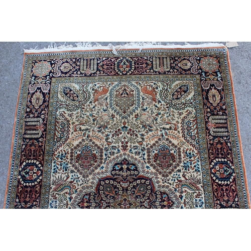 27 - Small Qum silk rug with central medallion floral and animal design with borders, 111 x 160cm, (fring... 