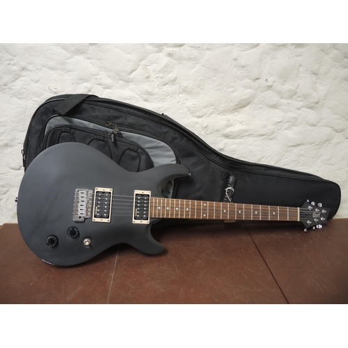 288 - Cort six string electric guitar with black black finish and soft carry case (as new)