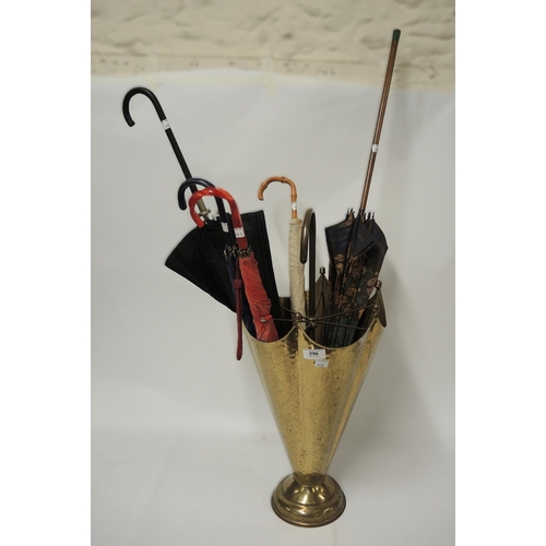 296 - Brass umbrella stand containing various umbrellas/parasols