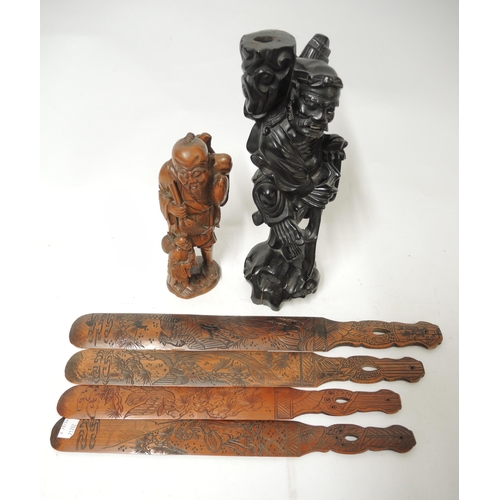 299 - Well carved boxwood figure of a fisherman, another carved hardwood figure of a sage and four carved ... 