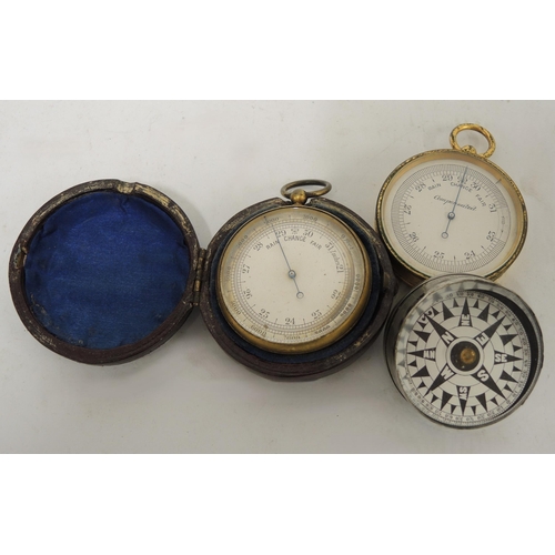 356 - 19th Century gilt metal pocket barometer housed in a leather case, together with another gilt pocket... 