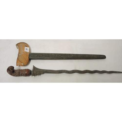 359 - Javanese kris with a carved grip and a brass scabbard