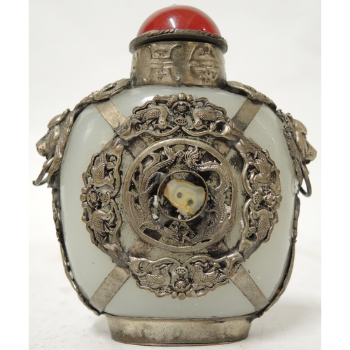 396 - 20th Century Chinese carved pale jade and white metal mounted snuff bottle, 8.5cm high