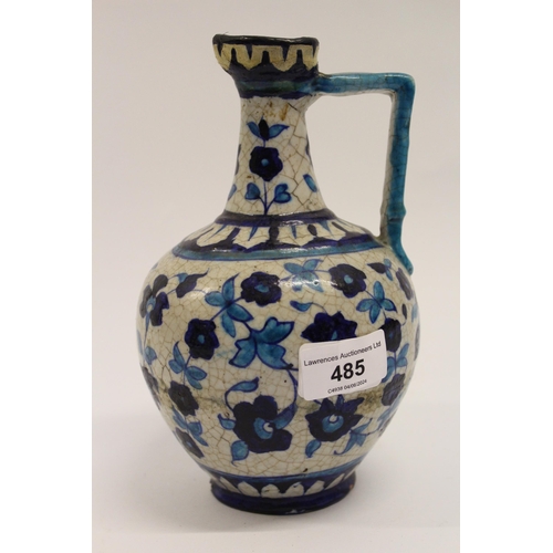 485 - Iznik salt glazed pottery jug with blue floral painted decoration (restored)