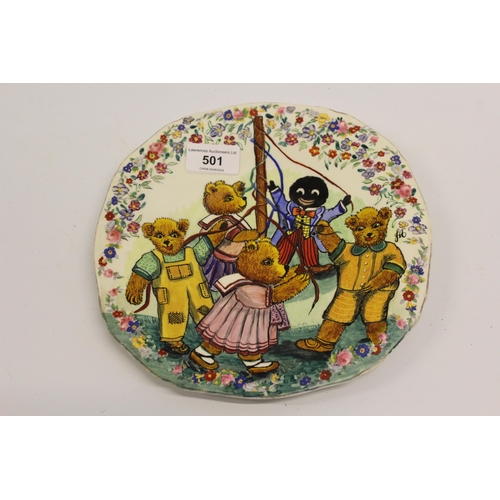 501 - Joan Allen, an Alfred Meakin plate painted with gollies and teddies dancing around a maypole, signed... 