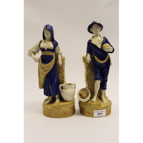 511 - Pair of Royal Dux figures of a Continental peasant boy and girl in blue and gold shot enamel, the bo... 