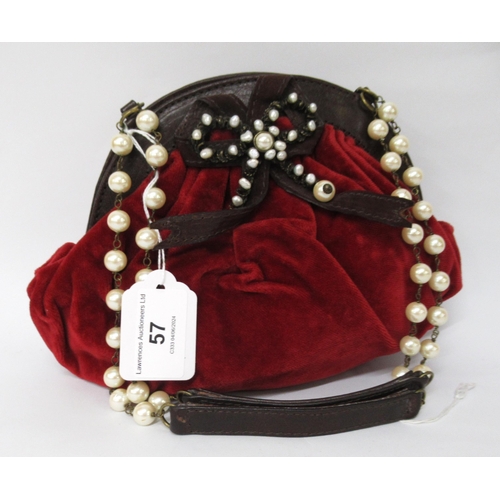 57 - Emanuel Ungaro, Paris, red velvet and leather trimmed evening bag with faux pearl handles, with dust... 