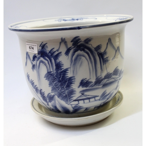 Chinese porcelain jardiniere with drip tray, blue and white decorated with a mountain landscape, 31cm diameter, 25cm high