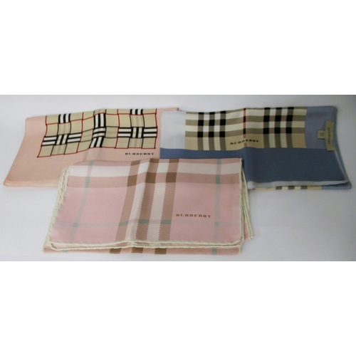 81 - Three various Burberry silk scarves