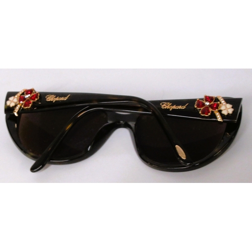 84 - Pair of ladies Chopard sunglasses in original case, together with another Chopard glasses case