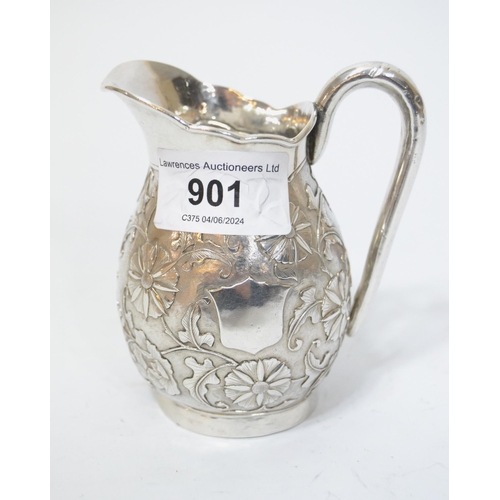 901 - Chinese silver cream jug having embossed floral decoration stamped ' Tsingtau Wam-pao ', with Chines... 