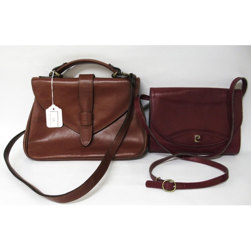 95 - Pierre Cardin burgundy leather handbag, 22.5cm wide, together with a brown leather bag