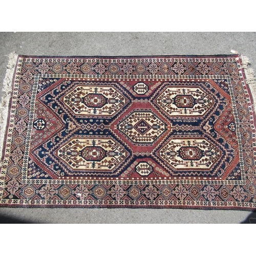 20C - Afshar rug with a five medallion design in shades of midnight blue, cream and red, 210 x 132cm