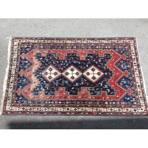 20D - Afshar rug with a triple hooked medallion design on a midnight blue ground with borders, 245 x 164cm