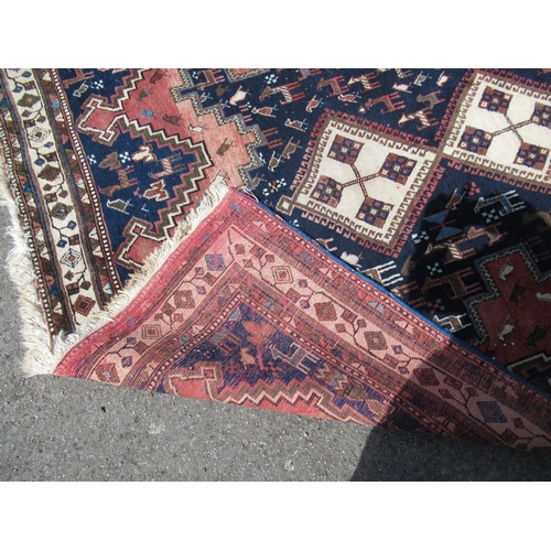 20D - Afshar rug with a triple hooked medallion design on a midnight blue ground with borders, 245 x 164cm