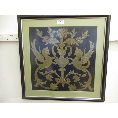 39 - Framed needlework picture, winged horses flanking a stylised vase, 39cm square