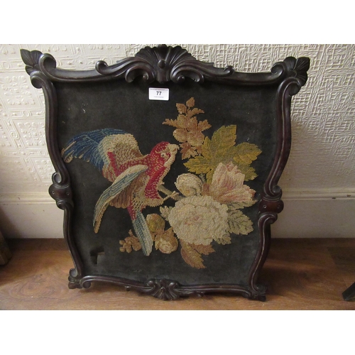 77 - 19th Century needlepoint panel depicting a bird and foliage in a shaped carved frame, 60 x 52cm appr... 