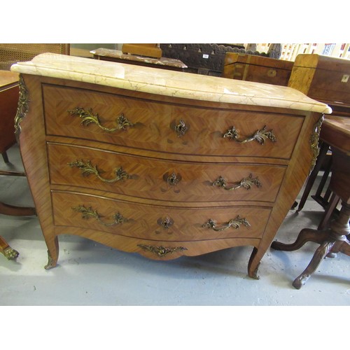 1944 - French kingwood marquetry and ormolu mounted commode with marble top above three drawers on cabriole... 