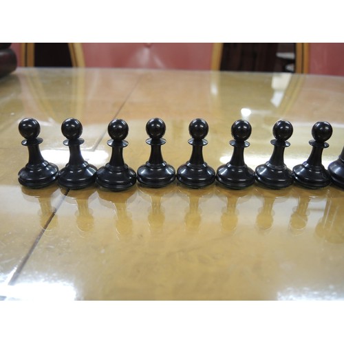 348 - Staunton pattern ebonised and boxwood chess set in later box, together with a large folding games bo... 