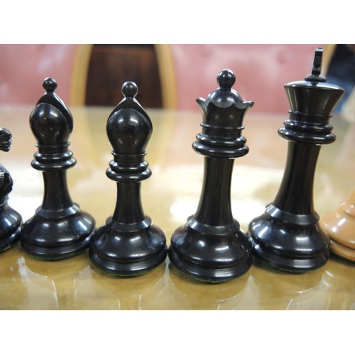 348 - Staunton pattern ebonised and boxwood chess set in later box, together with a large folding games bo... 