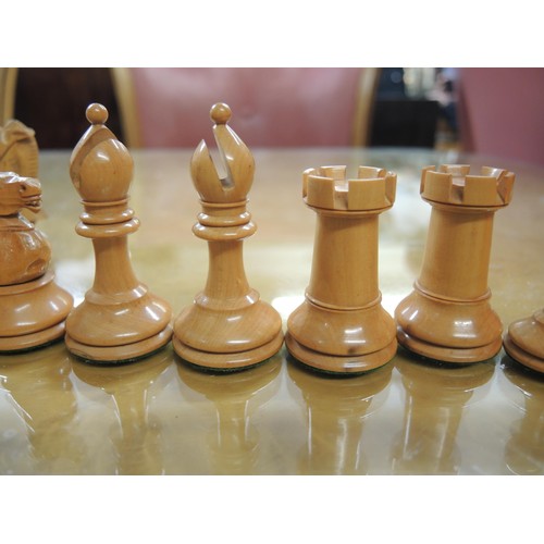 348 - Staunton pattern ebonised and boxwood chess set in later box, together with a large folding games bo... 