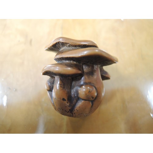 266 - Antique Japanese boxwood netsuke in the form of toadstools, with character mark signature to base, 3... 