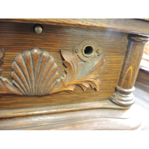 410 - Oak cased table model wind-up gramophone with large toleware horn, with decorative carved oak case i... 